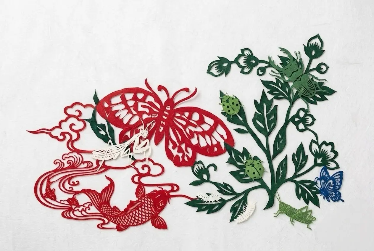 Chinese paper cutting butterfly and bird motifs inspired by folk visual traditions
